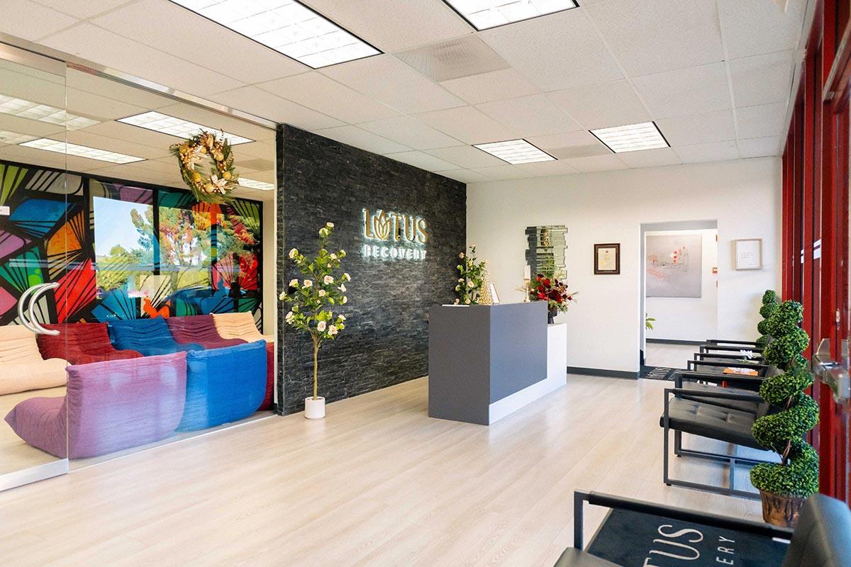 Front lobby with colorful mural and seating at Lotus Recovery