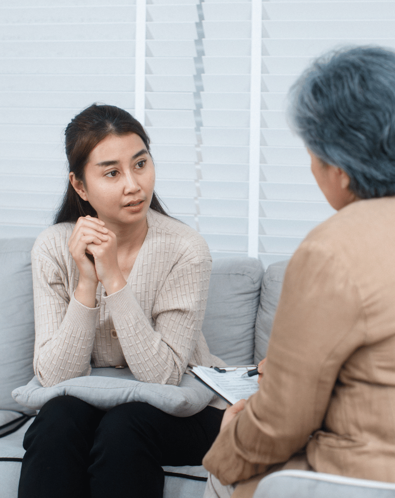 Therapist listening to a young woman during a session