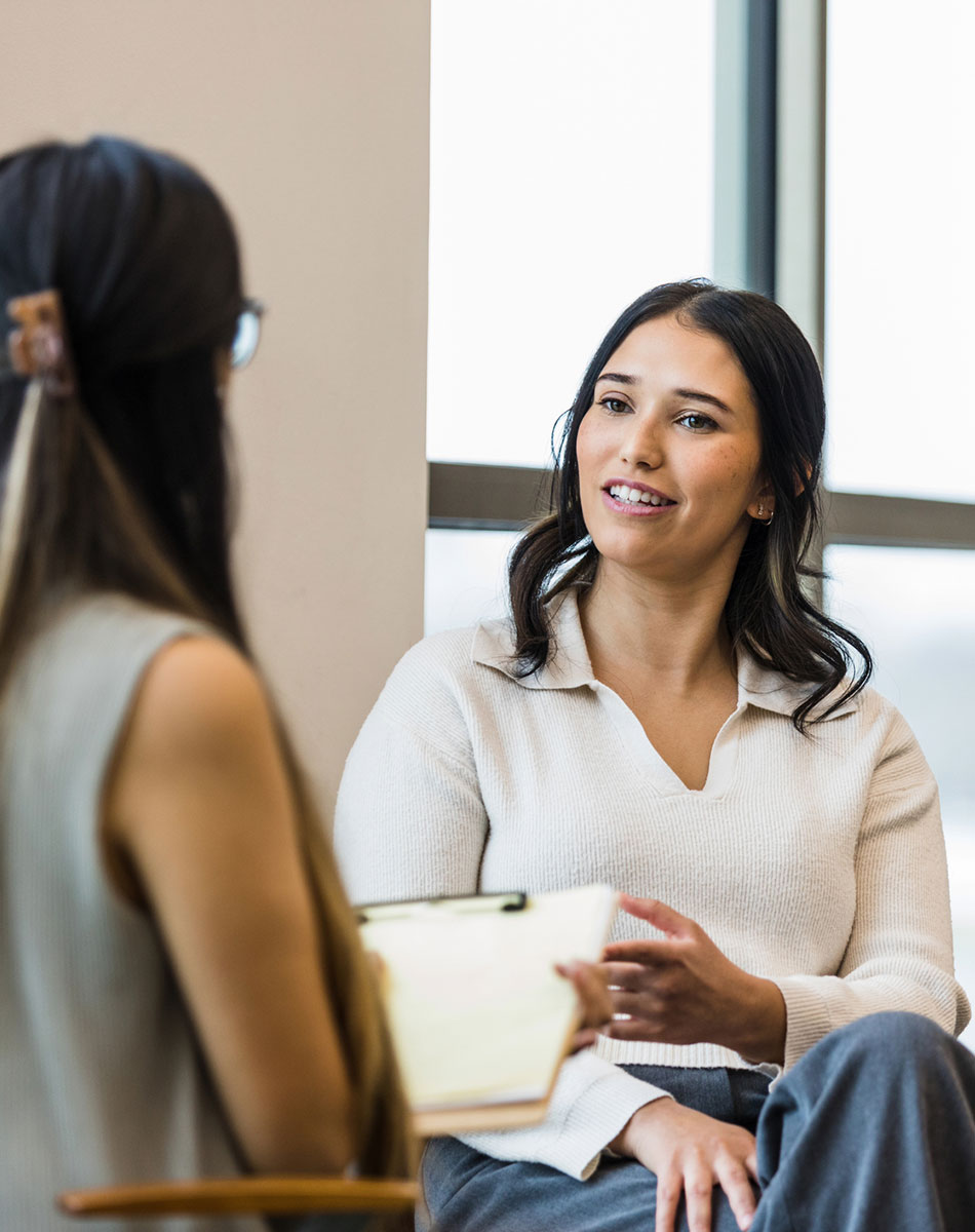 Therapist talking with a client during an individual therapy session